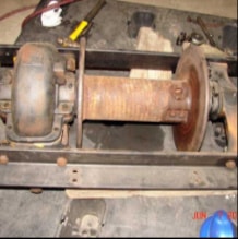 Halftrack winch mechanism with rollers and frame detail