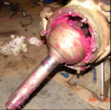 Halftrack front hub spindle with pink grease packed bearing