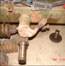 Halftrack steering knuckle and spindle components disassembled